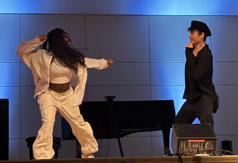 Abena Kyereme-Tuah and Zhixing Chen dancing unscored on stage in Paine Hall
